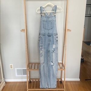 Distressed denim overalls